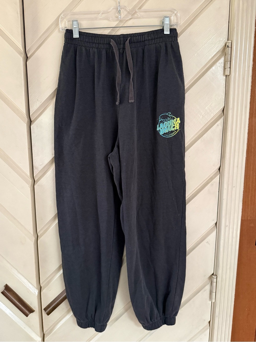 Divided Black Track Pants with Teal & Yellow Logo